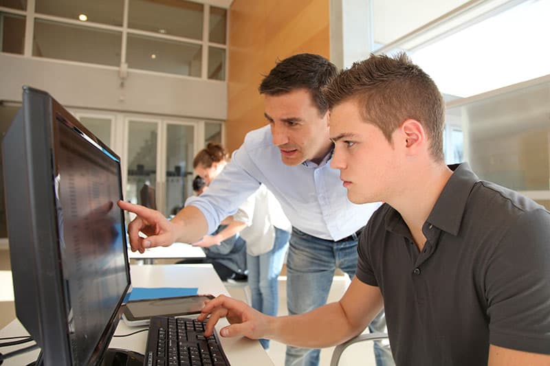 shriver-pic student sitting at computer